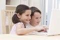 Boy & Girl Children Using Laptop Computer at Home Royalty Free Stock Photo