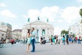 Boy and girl in the city on the square, cheerful lovers dreaming, walk the city, set