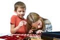 Boy and girl are considering coin collection isolated