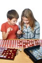 Boy and girl are considering coin collection isolated