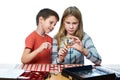 Boy and girl are considering coin collection isolated