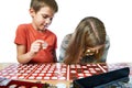 Boy and girl are considering coin collection isolated Royalty Free Stock Photo