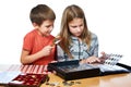 Boy and girl are considering coin collection isolated Royalty Free Stock Photo