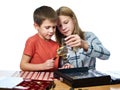 Boy and girl are considering coin collection isolated Royalty Free Stock Photo