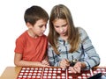 Boy and girl are considering coin collection isolated Royalty Free Stock Photo