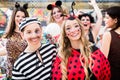 Boy and girl dresses as ladybird and prisoner at German fastnacht carnival procession Royalty Free Stock Photo