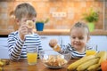 Boy and girl eating healthy fruit chips Royalty Free Stock Photo