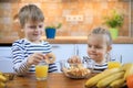 Boy and girl eating healthy fruit chips Royalty Free Stock Photo