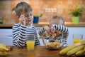 Boy and girl eating healthy fruit chips Royalty Free Stock Photo