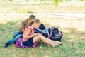 A boy and a girl are engaged in education and doing lessons in nature, preparing for entrance and final exams Royalty Free Stock Photo