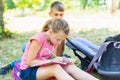 A boy and a girl are engaged in education and doing lessons in nature, preparing for entrance and final exams Royalty Free Stock Photo