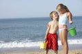 Boy And Girl Enjoying Beach Holiday Royalty Free Stock Photo