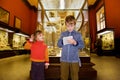 Boy and girl at excursion in historical museum Royalty Free Stock Photo