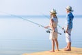 Boy and girl with fishing rods Royalty Free Stock Photo