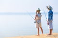 Boy and girl with fishing rods Royalty Free Stock Photo