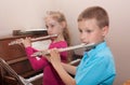 Boy, girl and flute Royalty Free Stock Photo