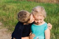 Boy and girl friends brother sister sitting on the ground Royalty Free Stock Photo
