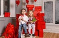 Boy and girl give a gift on Valentine day. Young couple hugging. Royalty Free Stock Photo