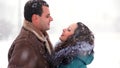 Boy and girl having hugs in the snow