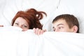 Boy and girl are hiding under the blanket Royalty Free Stock Photo