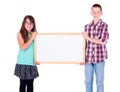 Boy and girl holding an empty advertising board Royalty Free Stock Photo