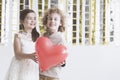 Boy and girl holding heart Royalty Free Stock Photo