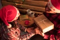 Boy and girl holding their hands and exchanging Christmas presents Royalty Free Stock Photo