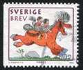 Boy and girl on horse by Bertil Almqvist