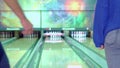 Boy and girl hug each other at the bowling