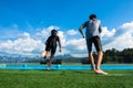 Boy and girl jumping into the pool in the lake. Royalty Free Stock Photo