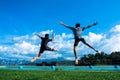 Boy and girl jumping into the pool in the lake. Royalty Free Stock Photo