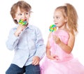 Boy and girl with lollipops