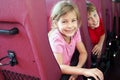 Boy and girl look in bus