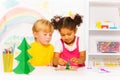 Boy and girl making forms of playing dough Royalty Free Stock Photo