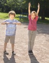 Boy and girl making physical excersises