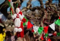 Red and white beautiful martisor balls closeup hanging on the branches of the tree