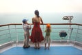 Boy and girl with mother standing on ship deck Royalty Free Stock Photo