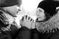Boy and girl outdoors on a winter walk playing snowballs Royalty Free Stock Photo