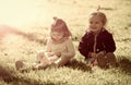 Boy and girl pick flowers on green grass Royalty Free Stock Photo