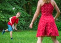 Boy and girl playing badminton Royalty Free Stock Photo