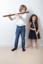 Boy and girl playing bamboo flute Royalty Free Stock Photo