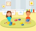 Boy and Girl Playing Building Blocks in Play Room