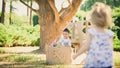 Boy and girl playing in a cardboard boat Royalty Free Stock Photo