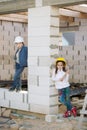 Boy and girl playing on construction site Royalty Free Stock Photo