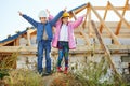 Boy and girl playing on construction site Royalty Free Stock Photo