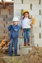 Boy and girl playing on construction site Royalty Free Stock Photo