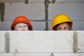 Boy and girl playing on construction site Royalty Free Stock Photo