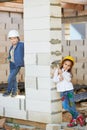 Boy and girl playing on construction site Royalty Free Stock Photo