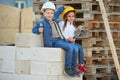 Boy and girl playing on construction site Royalty Free Stock Photo
