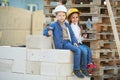 Boy and girl playing on construction site Royalty Free Stock Photo